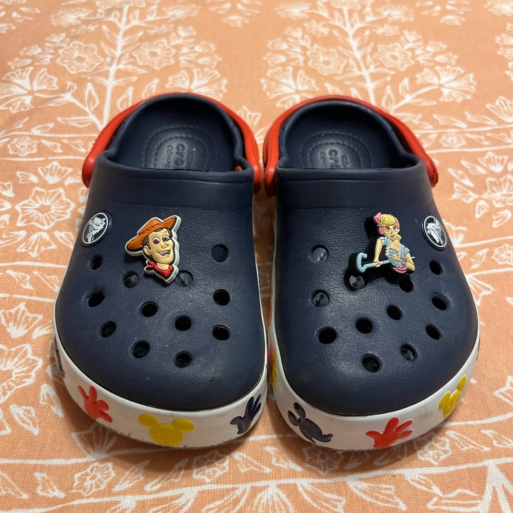 CROCS Blue and Red Sandals with Decorative Charms